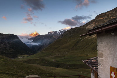 Scenic view of landscape against cloudy sky