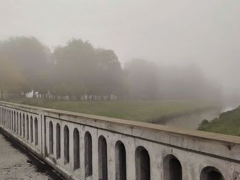Panoramic shot of landscape against sky during foggy weather