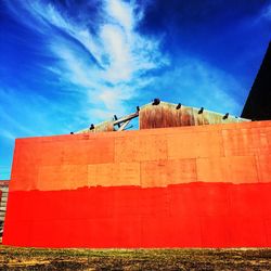 Low angle view of building against blue sky