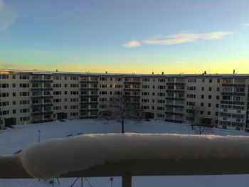 Buildings in city against sky