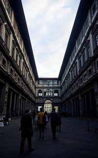 People walking on street in city