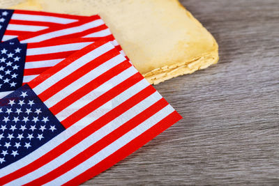 Close-up of american flags on table