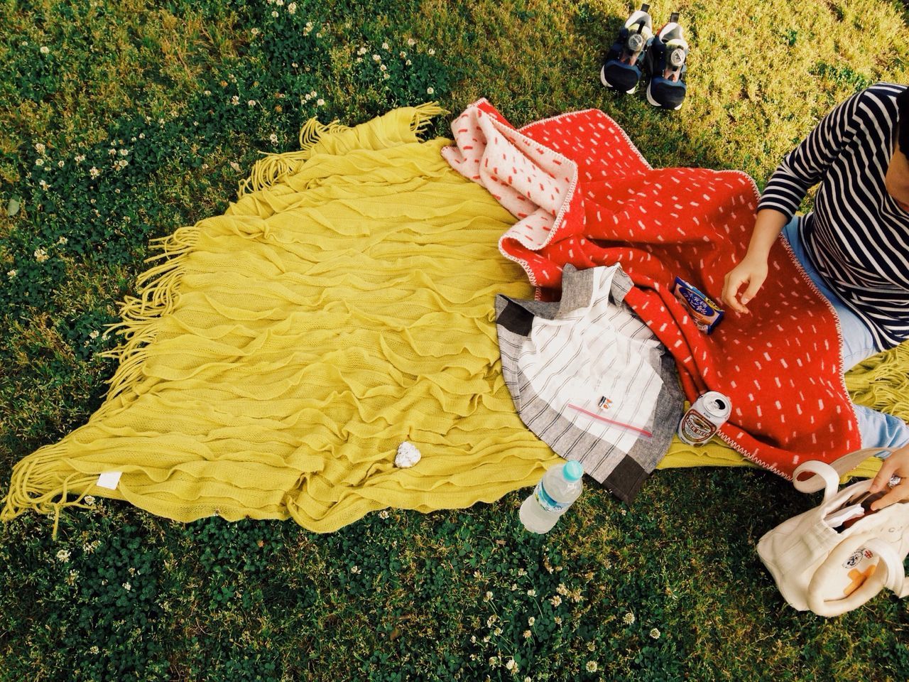 high angle view, grass, water, red, day, sunlight, shoe, outdoors, childhood, absence, footwear, low section, nature, grassy, field, chair, toy, no people, relaxation, transportation