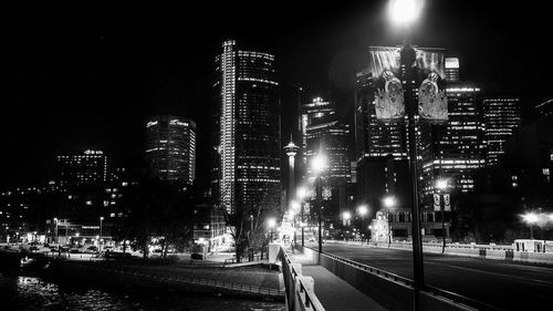 Panoramic view of illuminated city buildings at night