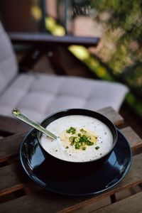 Close-up of soup served on table