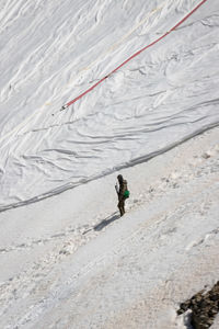 High angle view of person on snowcapped mountain