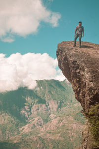 Rear view of man standing on mountain