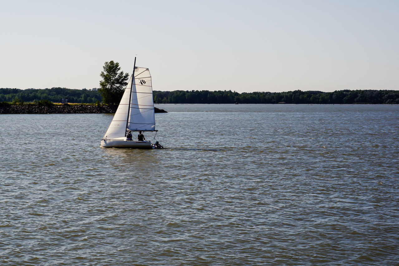 SAILBOATS SAILING ON SEA AGAINST CLEAR SKY