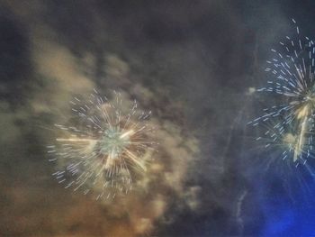 Close-up of fireworks against sky at night