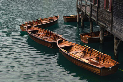 Boats moored in lake