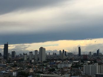 Aerial view of modern buildings in city against sky