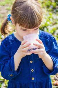 Rear view of woman holding ice cream