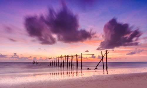 Scenic view of beach against sky during sunset