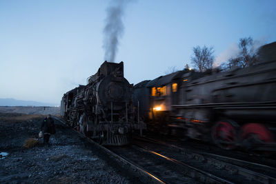 Train on railroad track against sky