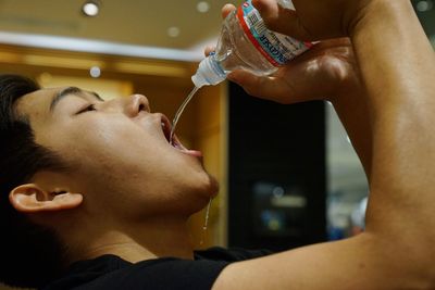 Close-up of man hand holding drink