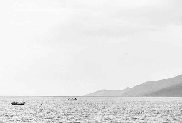 nautical vessel, water, transportation, waterfront, mode of transport, boat, sea, mountain, clear sky, tranquil scene, scenics, copy space, tranquility, beauty in nature, nature, sailing, mountain range, sailboat, idyllic, travel