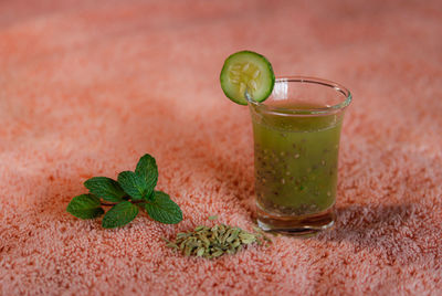 Close-up of green drink on table