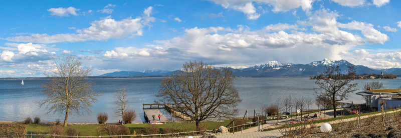 Panoramic view of lake and buildings against sky