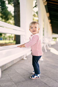 Portrait of cute boy standing outdoors