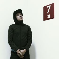 Man standing against white background