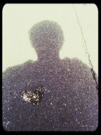 Shadow of people on road