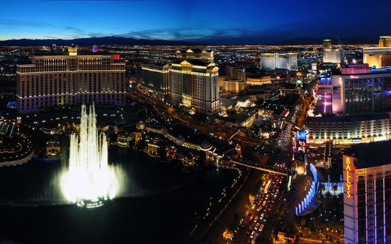 illuminated, city, night, architecture, building exterior, cityscape, built structure, high angle view, city life, sky, river, skyscraper, residential district, modern, water, crowded, capital cities, travel destinations, long exposure, residential building