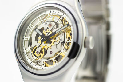 Close-up of wristwatch over white background