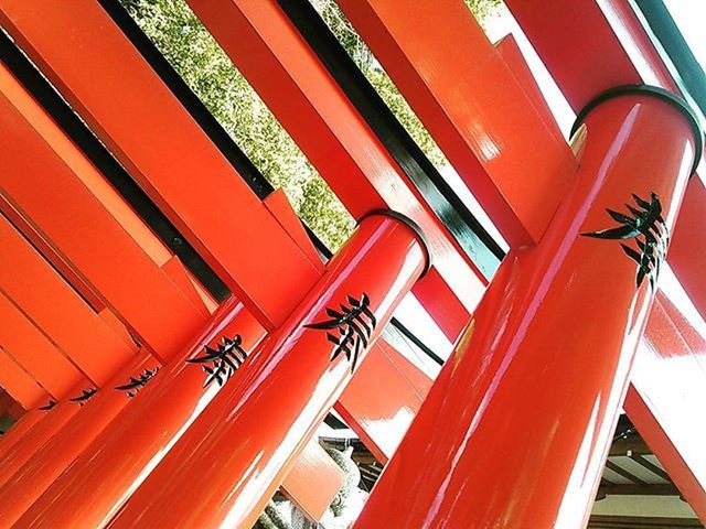 orange color, red, low angle view, built structure, architecture, railing, building exterior, transportation, part of, no people, outdoors, day, sunlight, yellow, close-up, cropped, steps, roof, metal, building