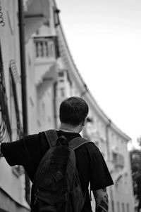 Rear view of man standing in city