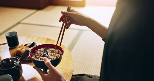 Cropped hand of person preparing food