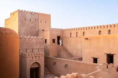 Low angle view of old ruins against clear sky
