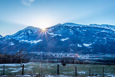 Scenic view of snowcapped mountains against sky