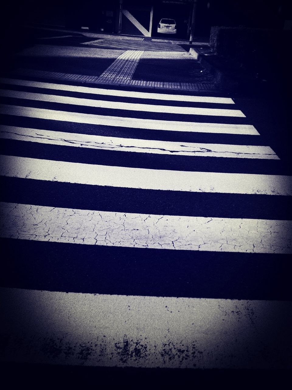road marking, street, the way forward, road, asphalt, high angle view, shadow, zebra crossing, steps, transportation, empty, striped, sunlight, outdoors, day, no people, diminishing perspective, pattern, white color, sidewalk