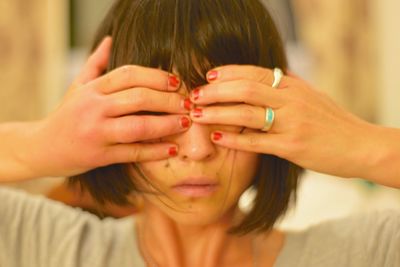 Close-up of hand holding sunglasses