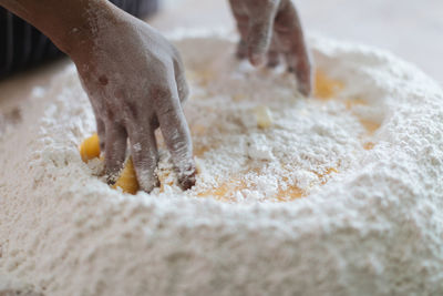 Close-up of person preparing food