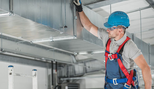 Portrait of man working in factory