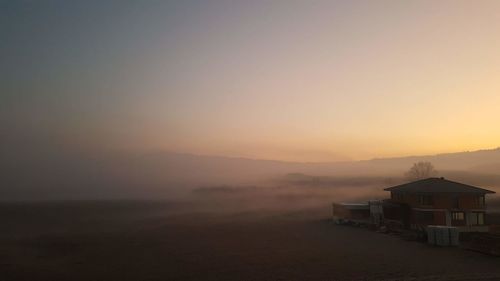 Scenic view of landscape against sky during sunset