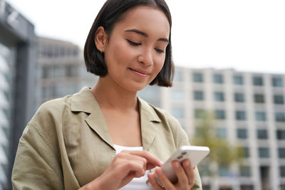 Young businesswoman using mobile phone