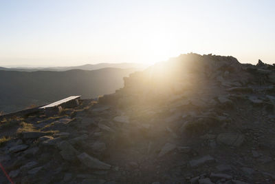 Scenic view of landscape against clear sky during sunset