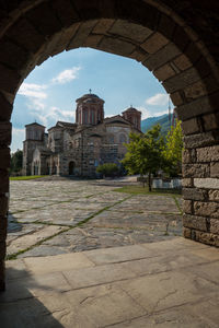 View of old building against cloudy sky