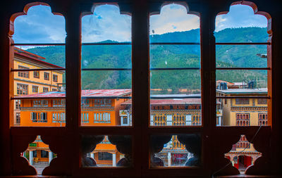 Buildings seen through glass window