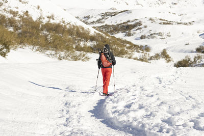 Man walking in the snow in mountain 