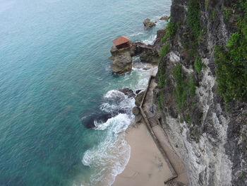High angle view of rocks by sea