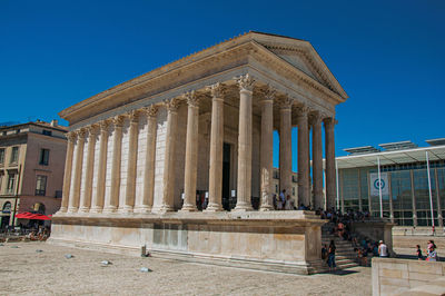 View of the maison carree, an ancient roman temple in the city center of nimes, france.