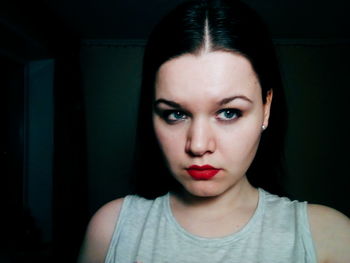 Close-up portrait of young woman looking away