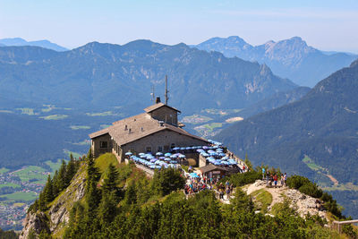 Panoramic view of buildings and mountains against sky