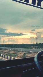 Car on road at sunset