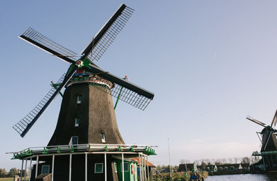 Traditional windmill against clear sky