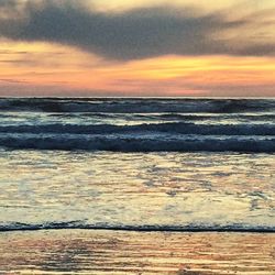 Scenic view of sea at sunset