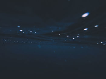 Full frame shot of sea against sky at night
